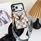 Louis Vuitton phone case with strap held by a hand on a light background